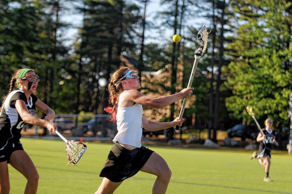 Grace Croitoru tries to keep the ball during the Hanover vs. Portsmouth Division II girls lacrosse championship in Manchester, N.H., on Tuesday, June 3. (Valley News - Sarah Priestap)