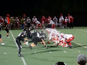 The defense waits for the snap at September 1st's varsity football game against Laconia. The Marauders won 16-7.