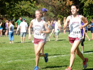 Varsity cross country runners Kennedy Lange and Emily Bregou race to the finish at Saturday's Manchester Invitational. The girls varsity team ranked third in the small schools race. 