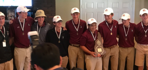 The varsity golf team receives the champions' plaque at Thursday's DII State Championships.