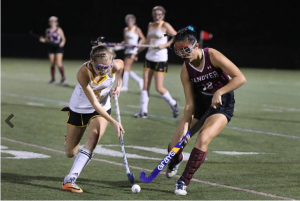 Jasmine Lou ('19) takes on a player from Souhegan High School in the field hockey D-II semifinal. Hanover won and went to the final, where they lost to Windham. Credit: Valley News - Charlie Hatcher. Republished with permission from Valley News.