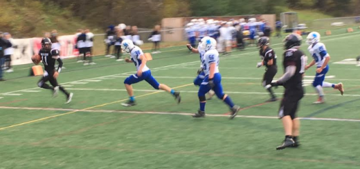 Hanover quarterback Alex Mosenthal runs for a touchdown during the NHIAA D-II quarterfinal versus Hollis-Brookline. The Marauders won 42-21. Credit: Hayden Smith