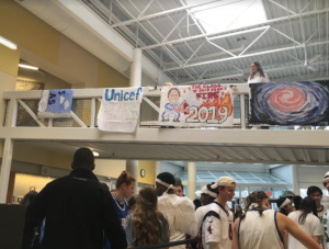 Each of the classes line the atrium bridge with a class banner. 